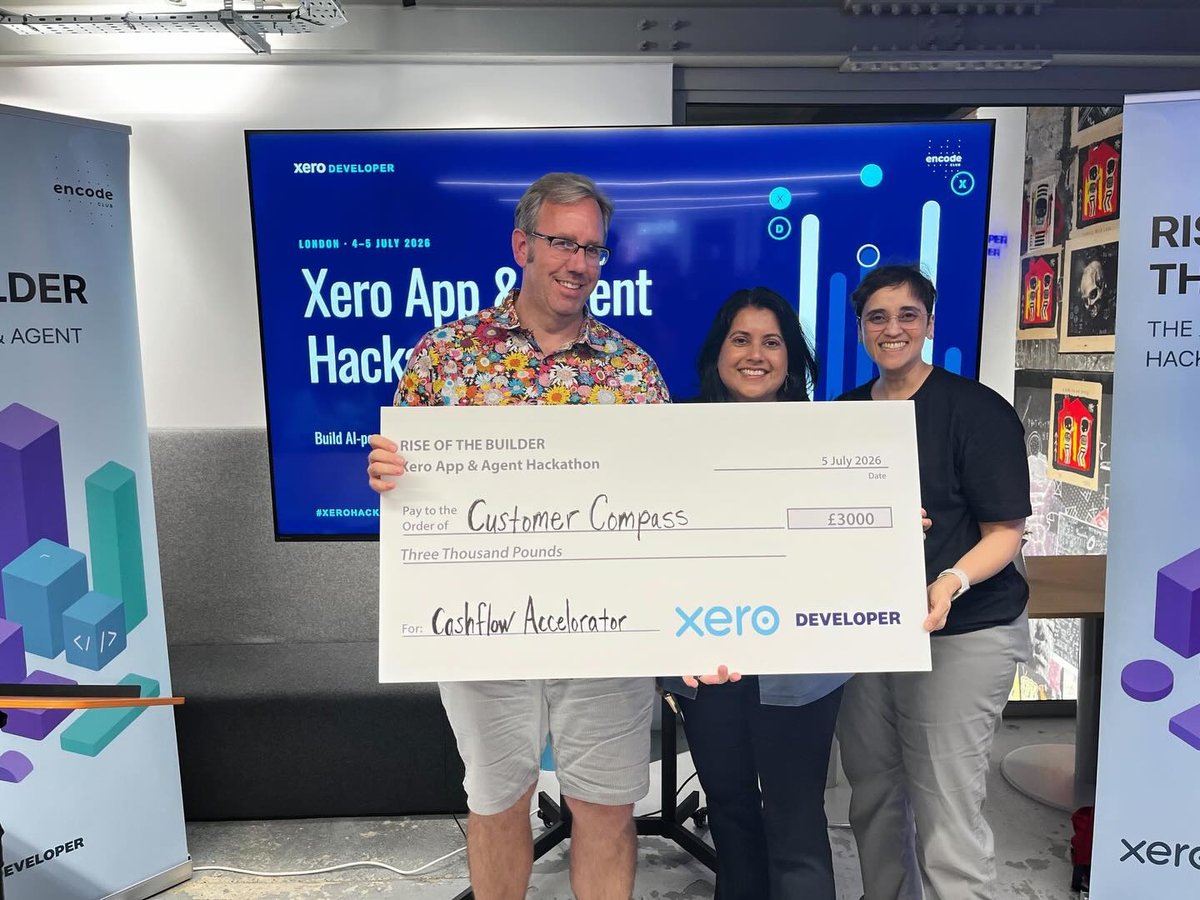 The Digital Tactics team collecting the Cashflow Accelerator winner's cheque for Customer Compass at the Xero App & Agent Hackathon, London, July 2026
